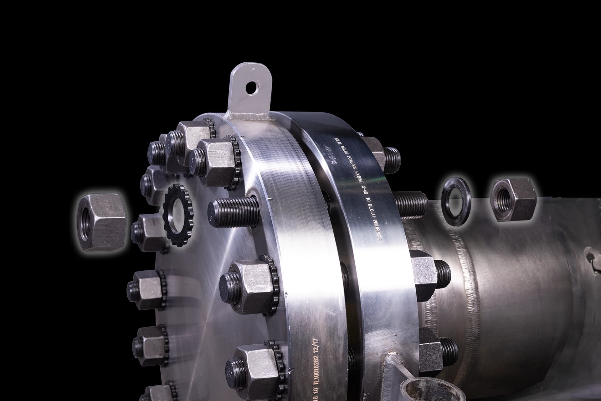 An exploded view of the HYTORC Washer System, including the HYTORC Reaction Washer and the HYTORC Backup Washer, on an application.