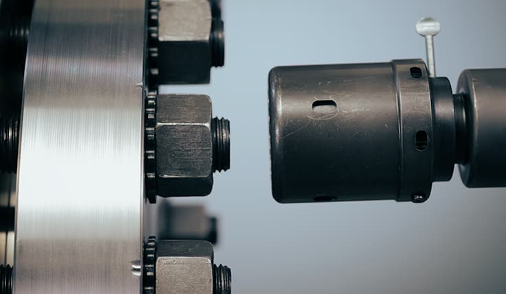 A close-up of the HYTORC Washer Driver about to be used on a bolt with a TRUE-LOCK Reaction Washer, showing that no reaction arm is needed